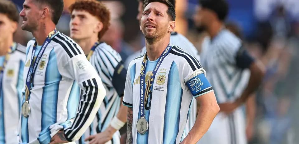 Lionel Messi with silver medal after match