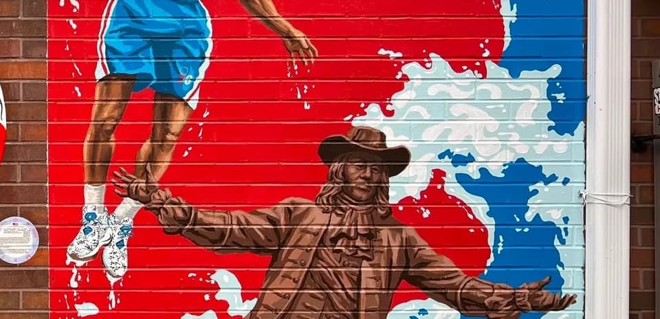 Mural of a basketball player and historical figure