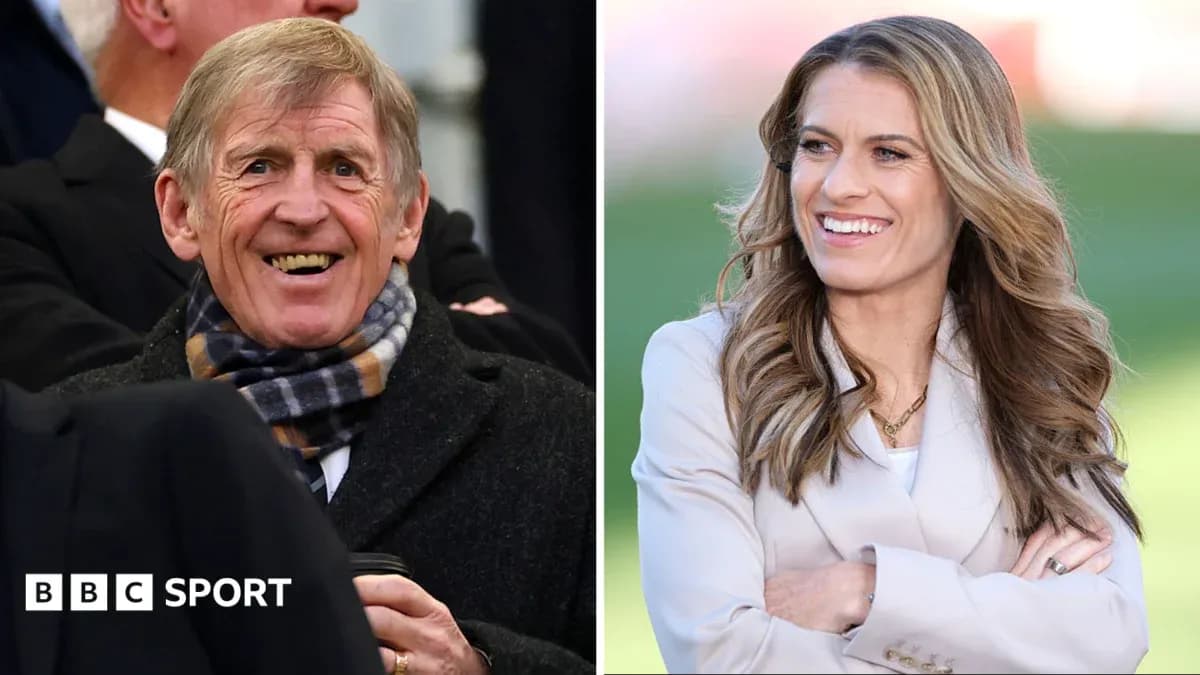 Two sports commentators smiling at an event
