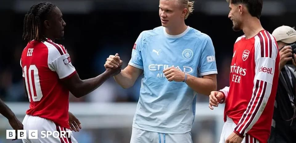 Eze, Haaland, and another player shaking hands