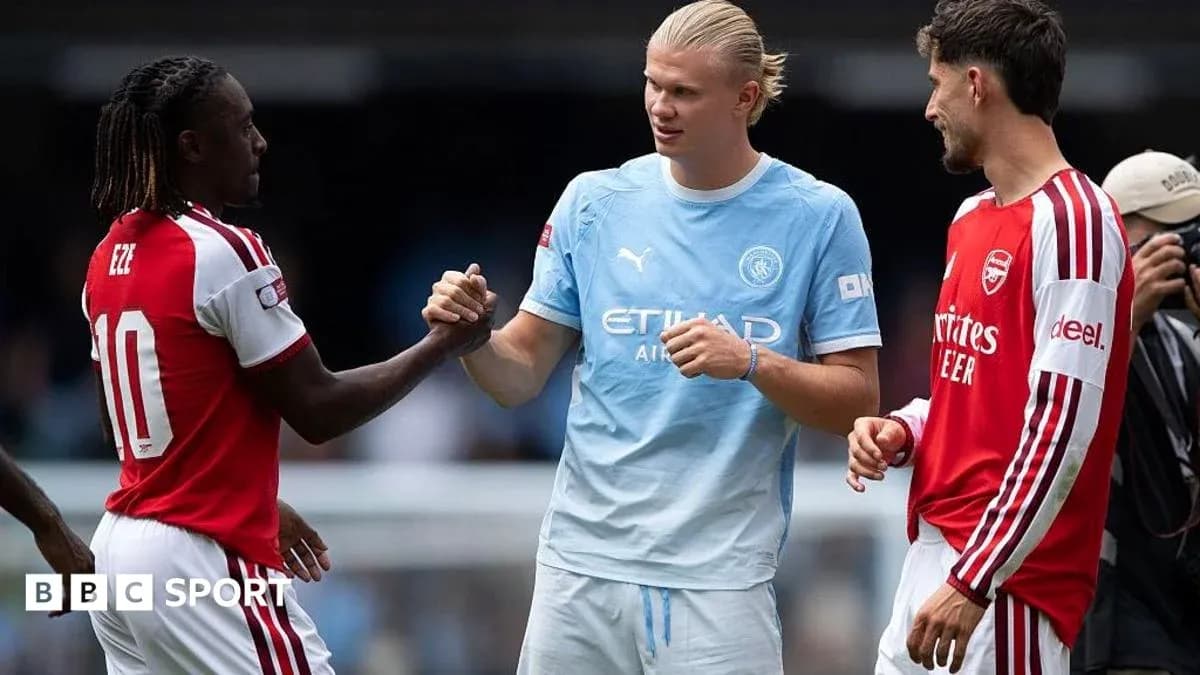 Eze, Haaland, and another player shaking hands