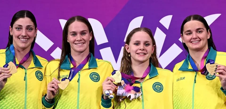 Australia's female swimmers celebrating medal win on podium