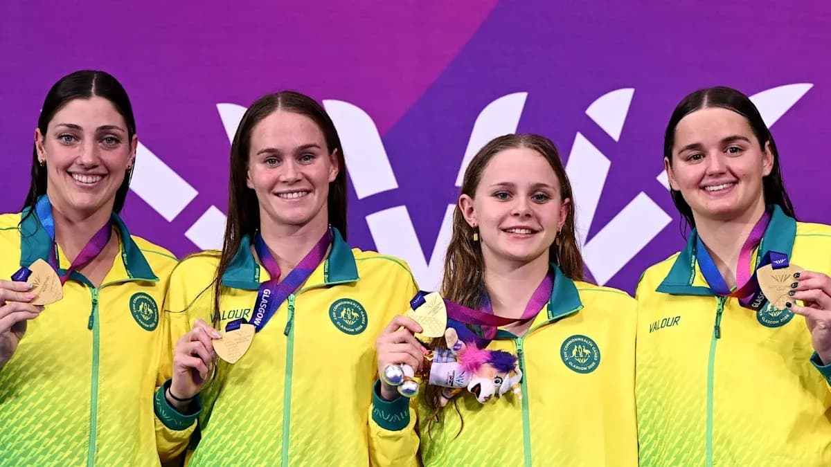 Australia's female swimmers celebrating medal win on podium