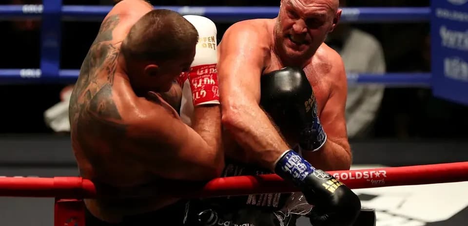 Boxers exchanging punches in the ring during match