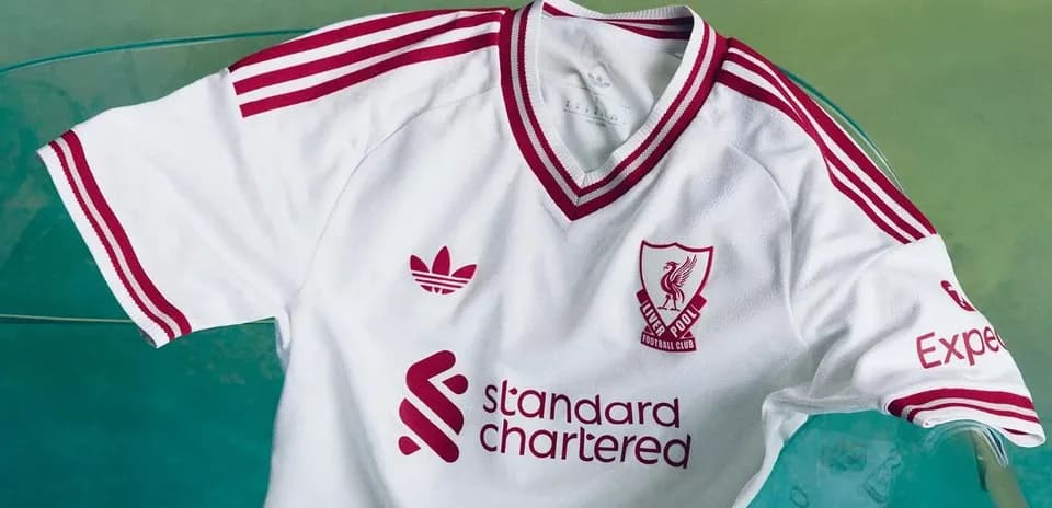 Liverpool FC white jersey with red details displayed