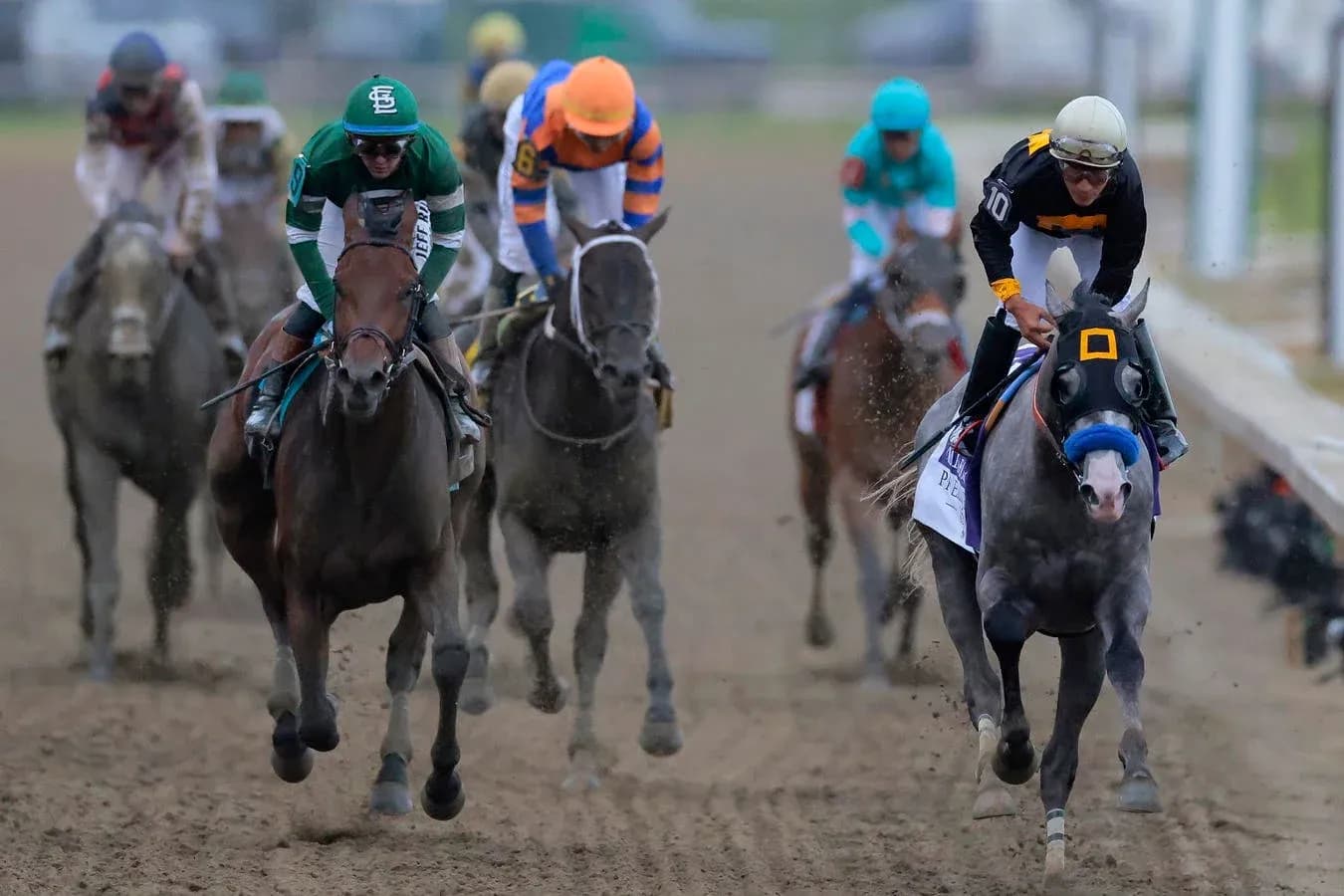Jockeys racing on horses during horse race
