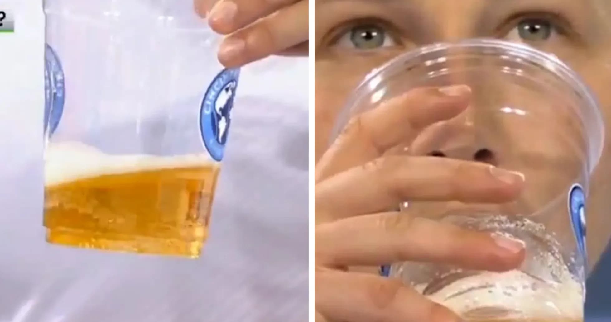 Person holding beer cup while drinking