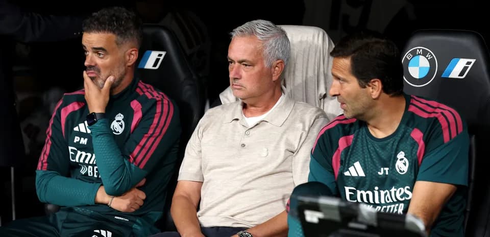 Real Madrid coaching staff on the bench during match