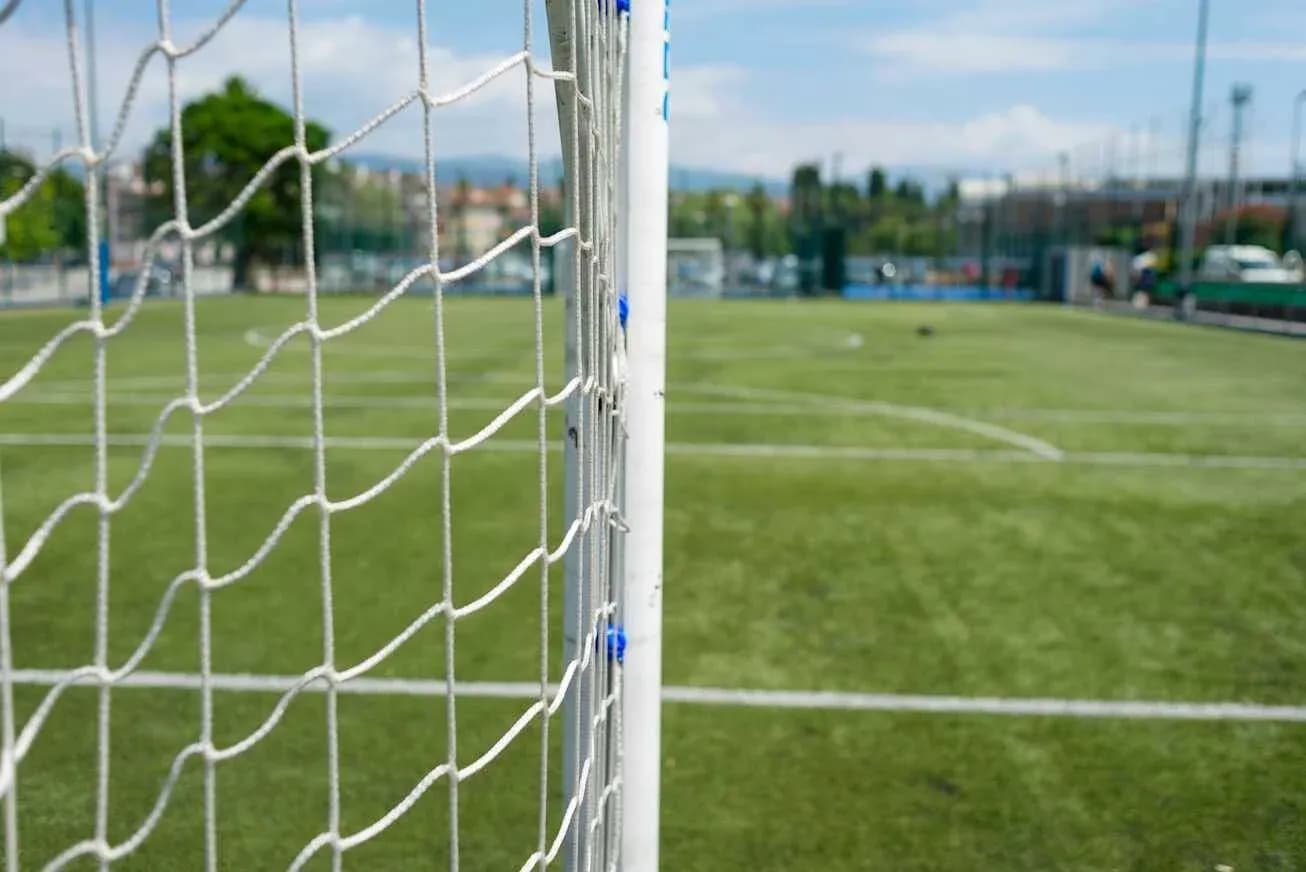 Football goalpost with net on training pitch
