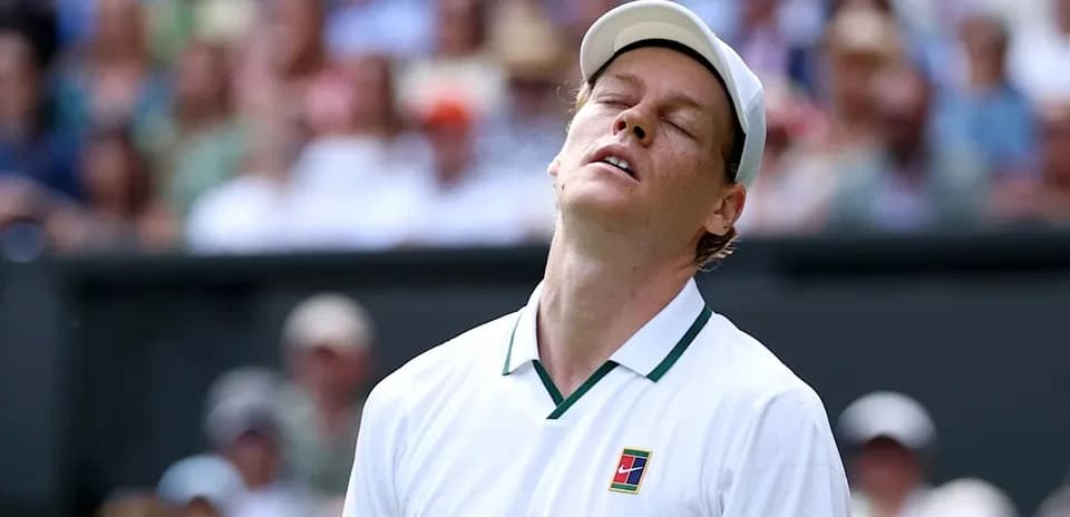 Tennis player reacting during a match at Wimbledon
