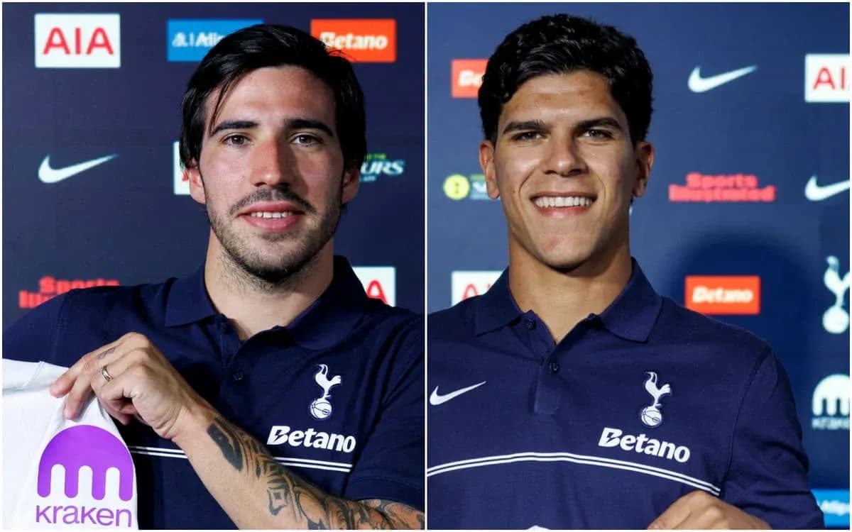 Two players presenting Tottenham Hotspur jerseys at event