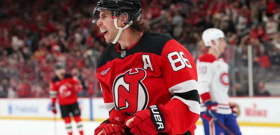 Hockey player celebrating goal in New Jersey Devils jersey