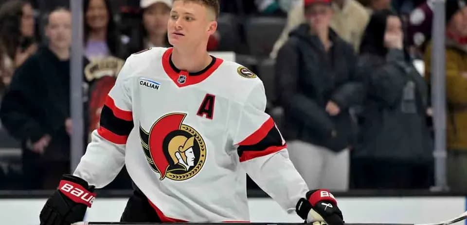 Hockey player in Senators jersey on the ice