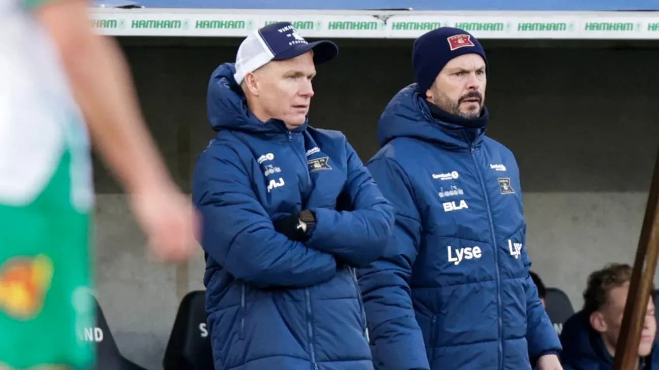 Trainers observing the match from the sidelines