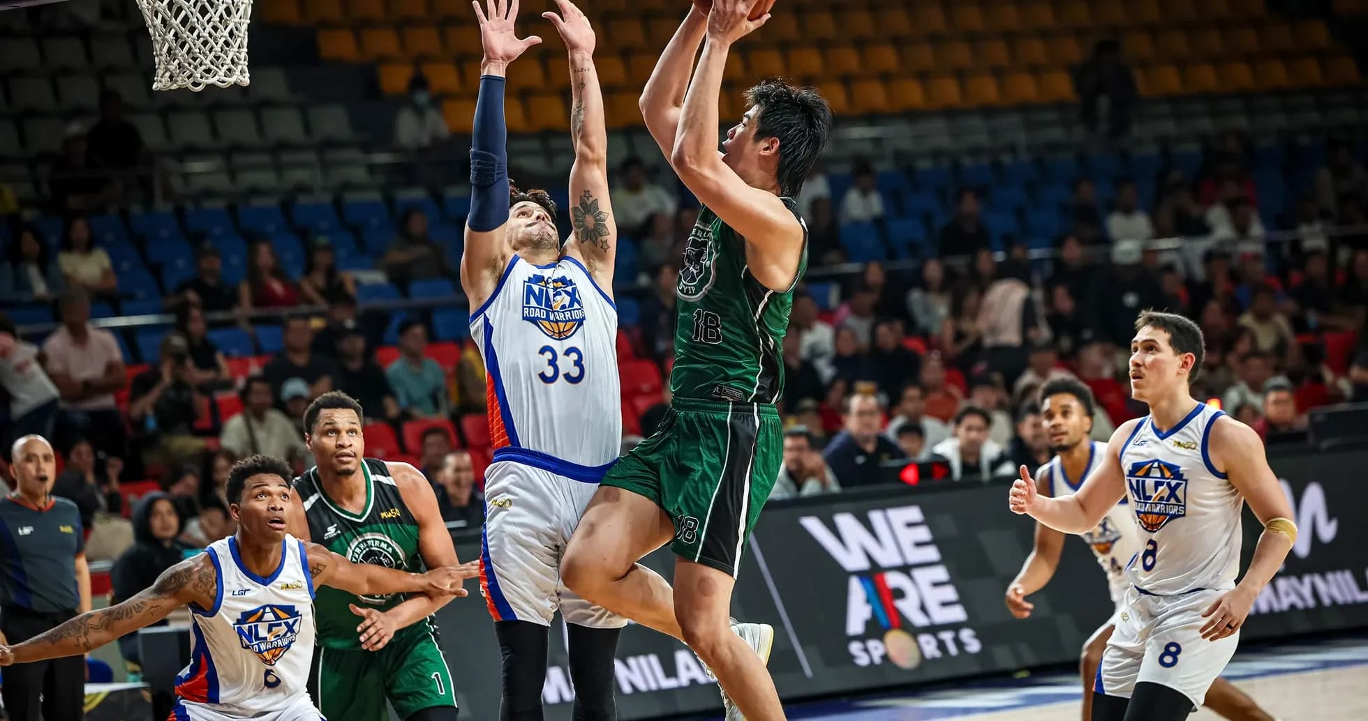 Player shooting a basketball during a game
