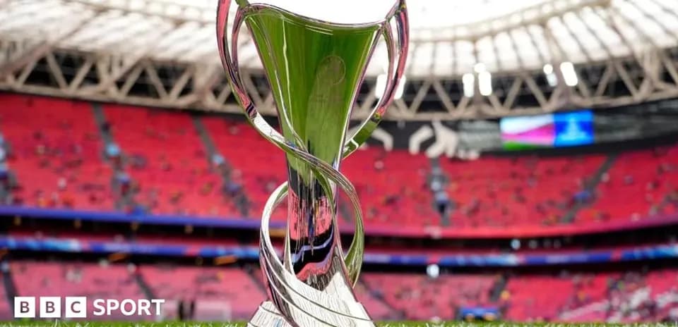 Trophy displayed on the pitch before the match