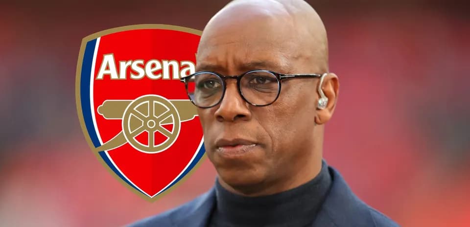 Analyst in front of Arsenal club logo