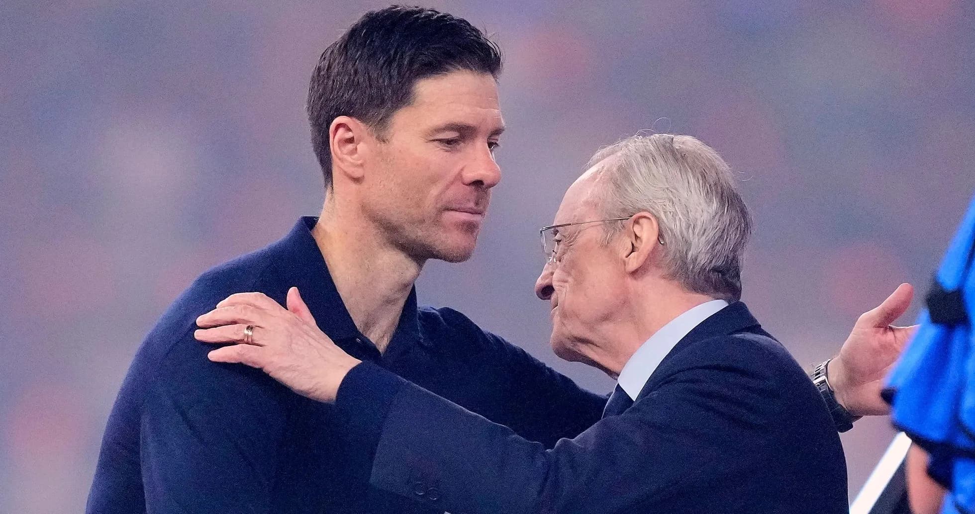 Xabi Alonso and Florentino Pérez embracing warmly