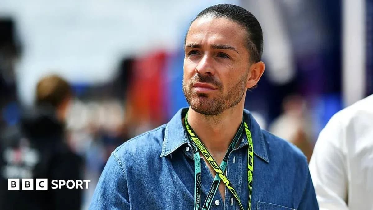 Man in denim shirt at motorsport event