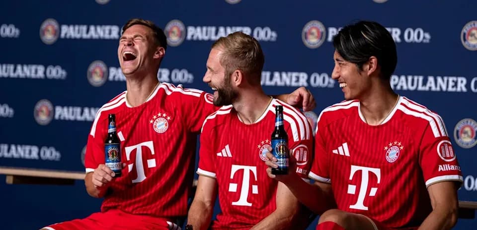 Bayern Munich players posing with drinks in jerseys