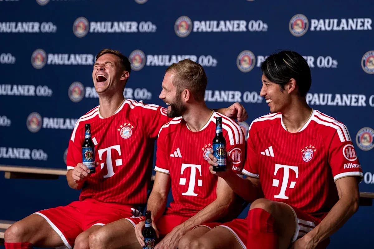 Bayern Munich players posing with drinks in jerseys