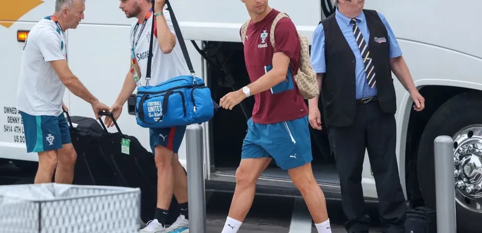 Cristiano Ronaldo arriving at team bus with staff