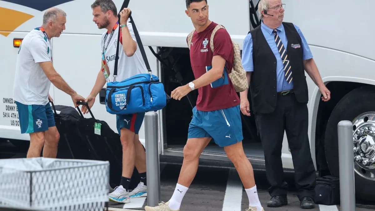 Cristiano Ronaldo arriving at team bus with staff