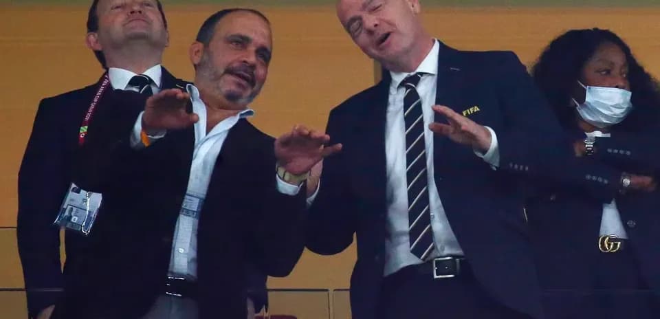 Officials interacting in VIP box during event
