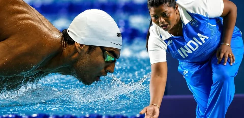 Svivor swimming with coach assisting at poolside