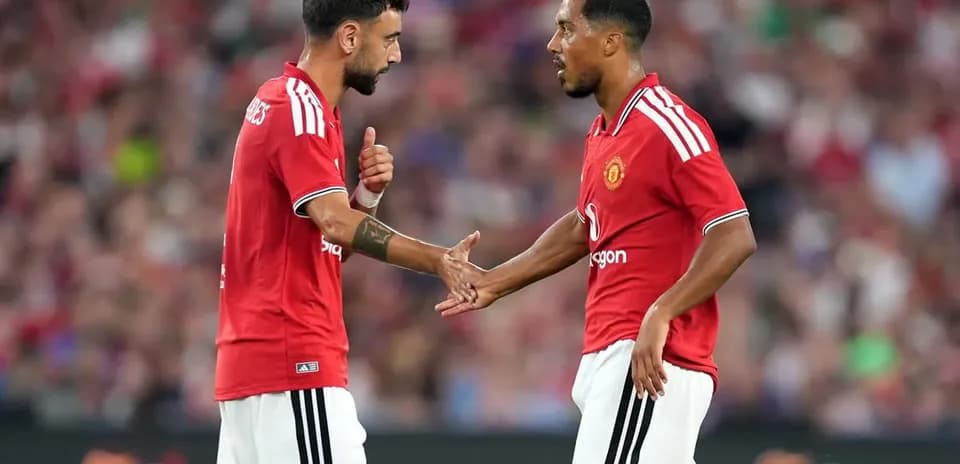 Bruno Fernandes and teammate discussing during match