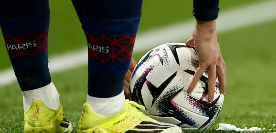 Player placing ball for a set piece