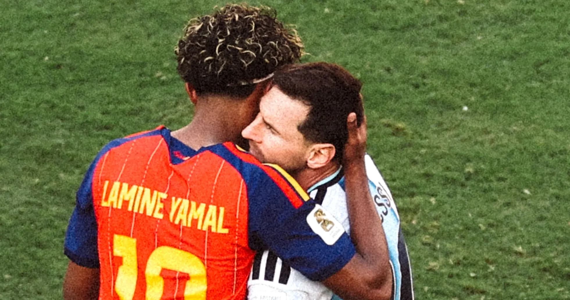 Two players embracing on the field after match