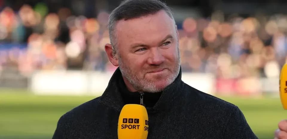 Analyst speaking during sports broadcast with microphone
