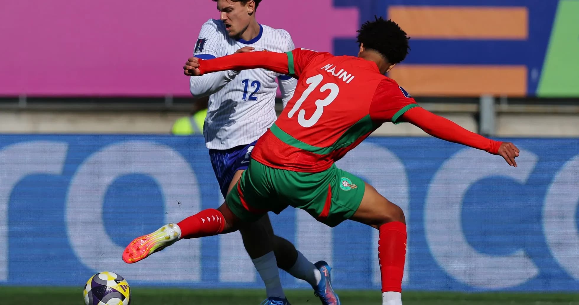 Two players battling for the ball during match