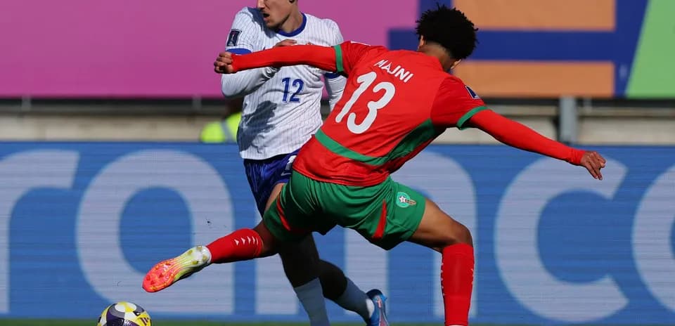 Two players battling for the ball during match