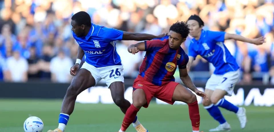 Birmingham and Barcelona players contesting for the ball