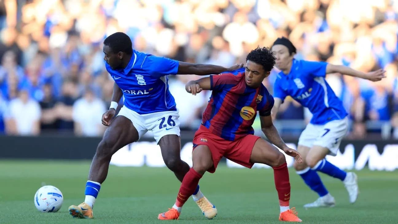 Birmingham and Barcelona players contesting for the ball