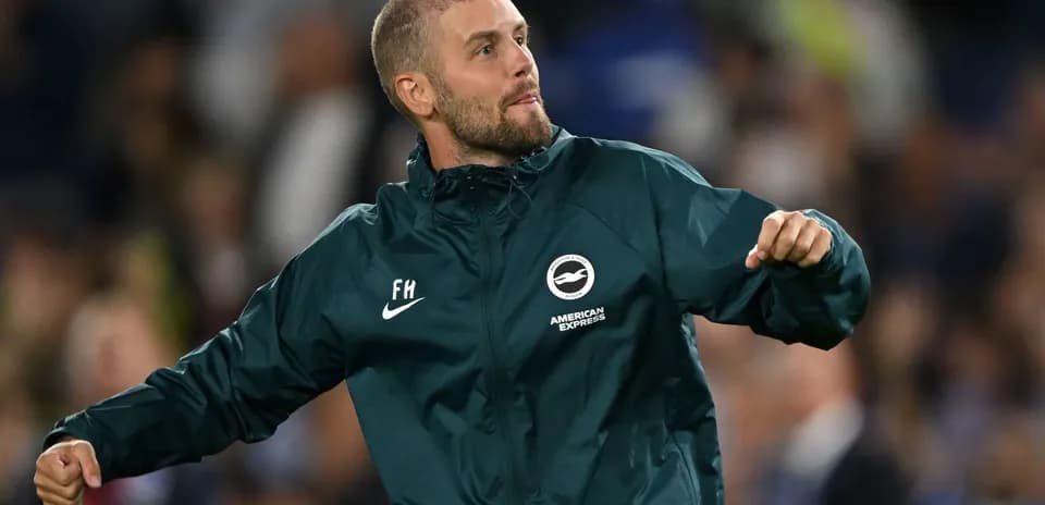 Coach celebrating during a match on the sideline
