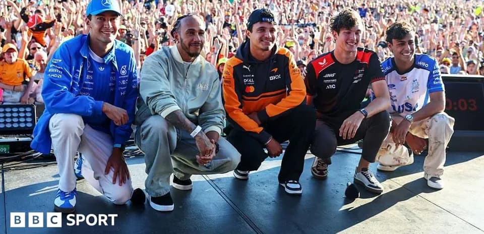 Formula 1 drivers posing on stage at event