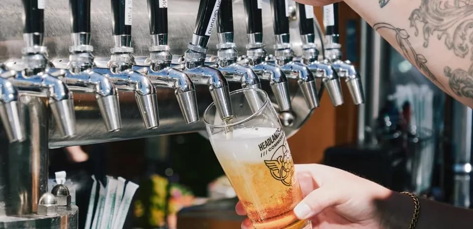 Shandy being poured from beer tap into glass