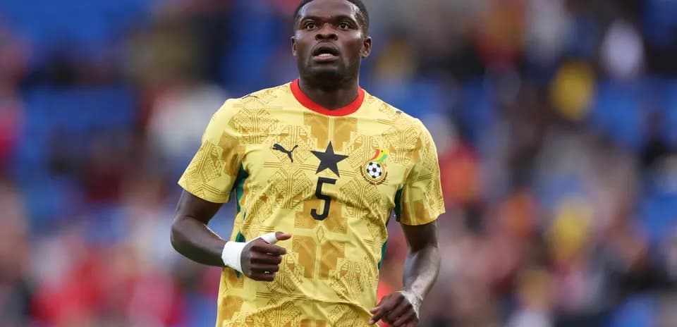 Ghana player in yellow kit during match