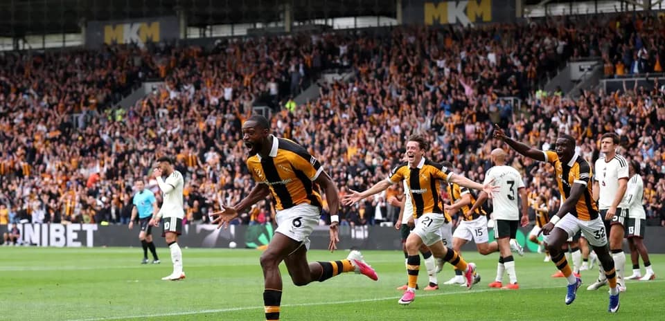 Hull City players celebrating a goal in stadium