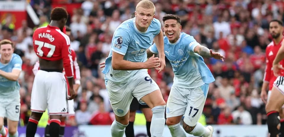 Erling Haaland celebrating a goal with teammates