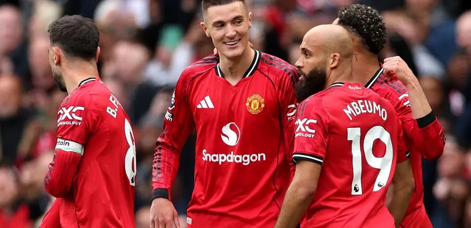 Manchester United players celebrating during a match