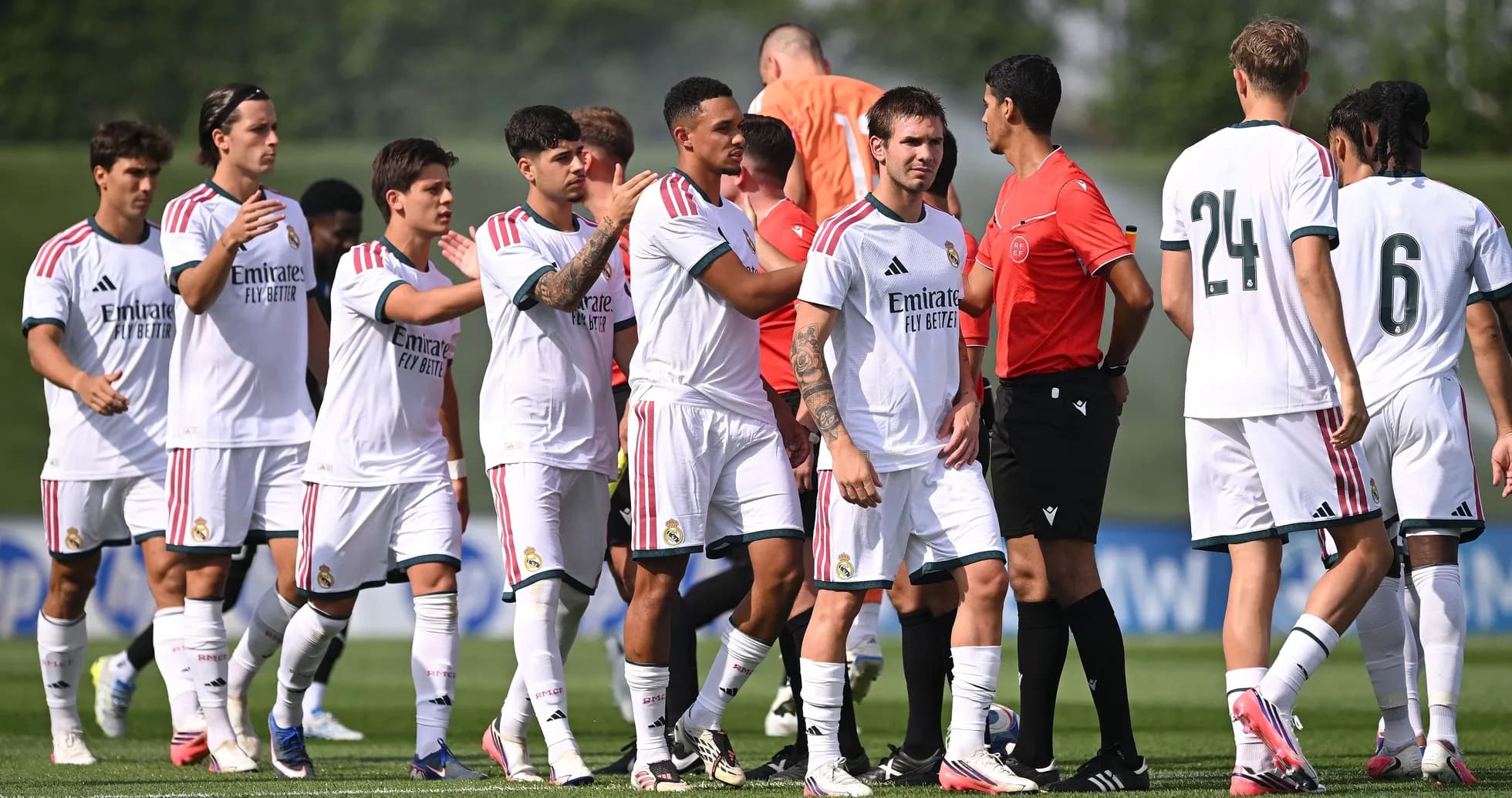 Real Madrid players greeting referee before match