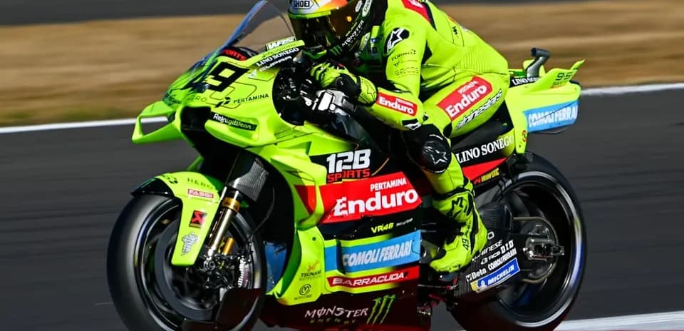 Motogp rider racing on a bright green motorcycle