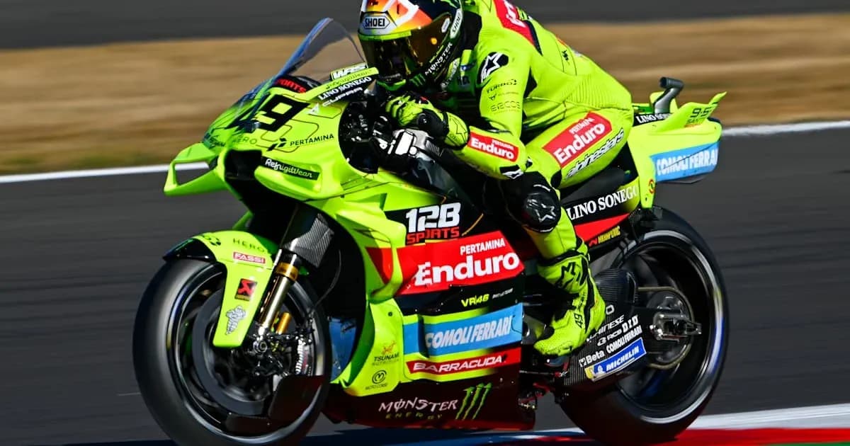Motogp rider racing on a bright green motorcycle
