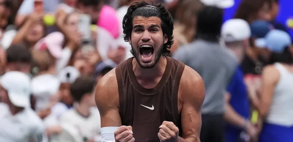 Tennis player celebrating victory with clenched fists