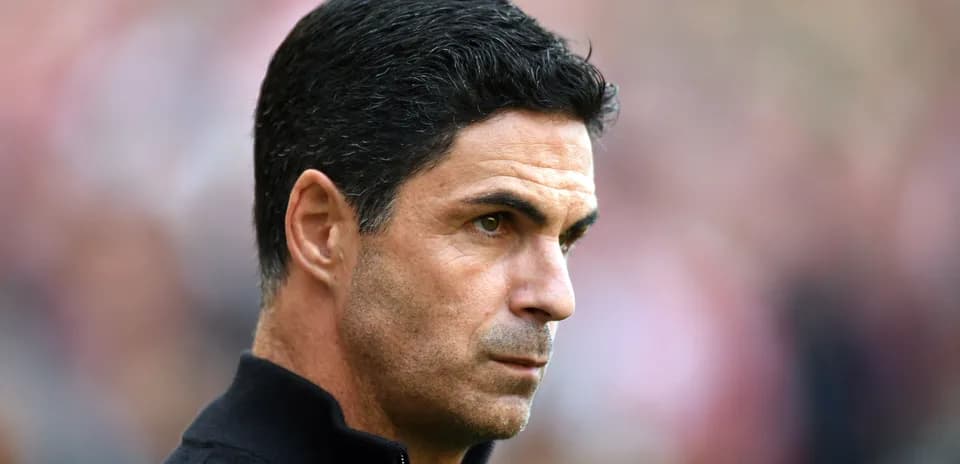 Mikel Arteta observing the match from the sidelines