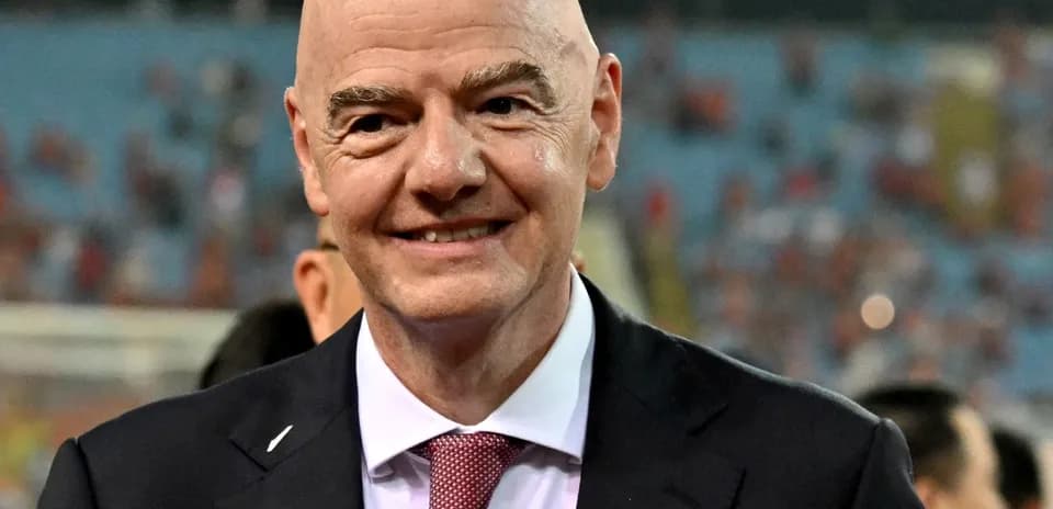 FIFA president smiling during event at stadium
